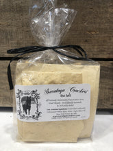 Load image into Gallery viewer, Saratoga crackers will Keep your cheese platters top notch, your parties one-upping, and your healthy snacking on point! Dairy free cracker varieties include: sea salt, sea salt and black pepper, rosemary olive, and &quot;everything&quot; (like the bagel...) Each package is 3.5 oz., contained in a cellophane to retain freshness, sealed with a black tie.
