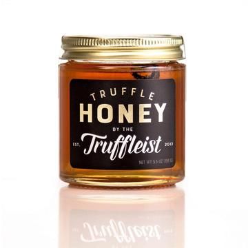 A Beautiful Wildflower Honey From Tremblay Apiaries Located In Van Etten, NY infused with Black Summer Truffles from Northern Italy. Every jar contains a slice of truffle as well. Ideal for a cheeseboard, in a vinaigrette, combined with savory desserts, dripped on a goat cheese crostini, or over a fig and caramelized onion pizza.     Ingredients:  Raw Local Wildflower Honey (Finger Lakes, NY), Black Summer Truffles (2%), Truffle Essence  5.5 oz glass jar