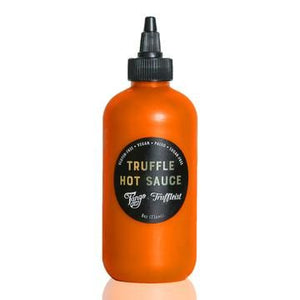 The Truffleist partnered with  Tango Chile Sauce so you can bring the heat with your truffle game with this limited edition hot sauce. Use it as a dipping sauce for fries and chicken wings, or top your favorite food like avocado toast and nachos.  This is a mild hot sauce.    Ingredients:  Carrots, apple cider vinegar, garlic, limes, chile peppers, sawtooth cilantro, truffles, sea salt, truffle flavoring.  8 oz. plastic bottle with screw top dispenser. Bottle has a tamperproof seal.