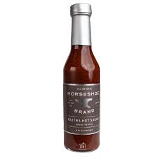 A fiery concoction of the hottest peppers in the world. Habanero and the Bhut Jolokia (ghost pepper) along with roasted garlic, onion, and brown sugar make this sauce ideal for those who enjoy abundant heat and abundant flavor.     8 oz. glass bottle with tamper resistant wrapping.