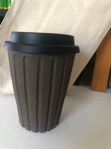 This keep cup is made with a slightly tapered shape to fit comfortably in most car cup holders. keep in mind, this cup will get warm with the heat of your beverage.  This item is hand made so no two pieces are exactly alike. please expect slight variations in size, shape and finish. it is made using food safe clay and glazes.  approximately 4.5” tall + the height of the lid, holds approximately 10 oz