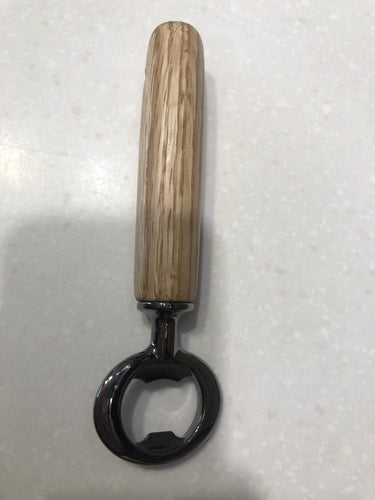 Quick and easy to pop the top off of your favorite bottled beverage.  Wooden handles are expertly turned on a lathe.  Local hardwoods are selected to bring you an enduring and sturdy utility item that will last for decades.  Sanded, shellac finish and metal work.  Approximately 6