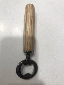 Quick and easy to pop the top off of your favorite bottled beverage.  Wooden handles are expertly turned on a lathe.  Local hardwoods are selected to bring you an enduring and sturdy utility item that will last for decades.  Sanded, shellac finish and metal work.  Approximately 6" long.